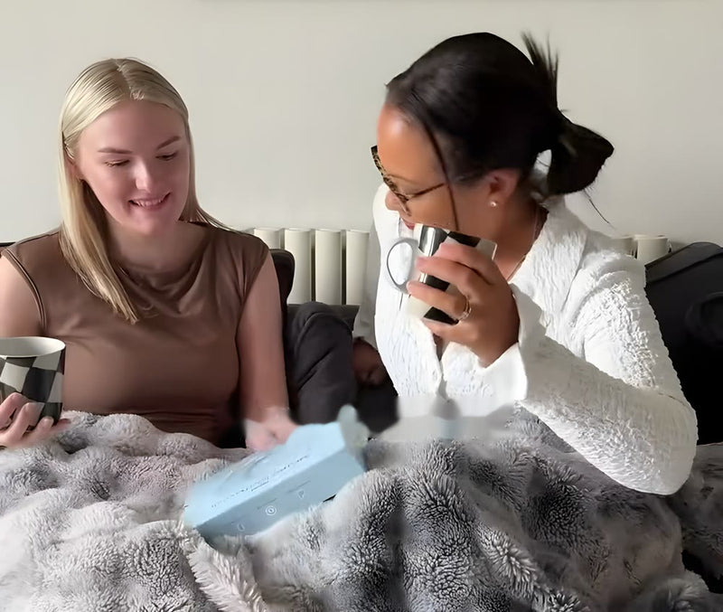 Mum and daughter on the sofa with a Myoovi box